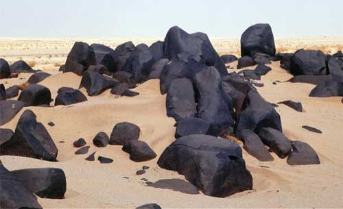 A weathering rind, called desert varnish, has built up on these rocks, Mauritania.