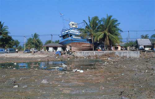 Large boat washed to shore after a tsunami in Thailand, 2004.