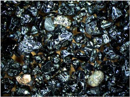 Shiny black obsidian sand from Hawaii, USA. © Abigail Burt